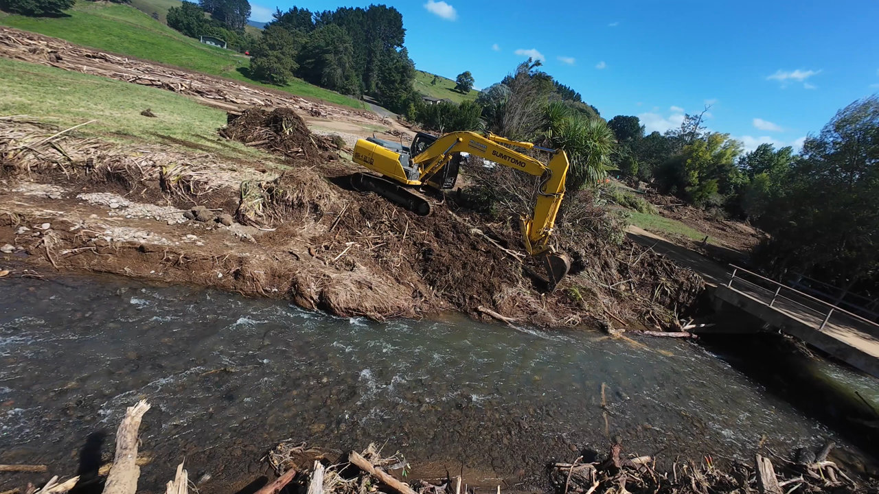 Flood damage being fixed with excavator