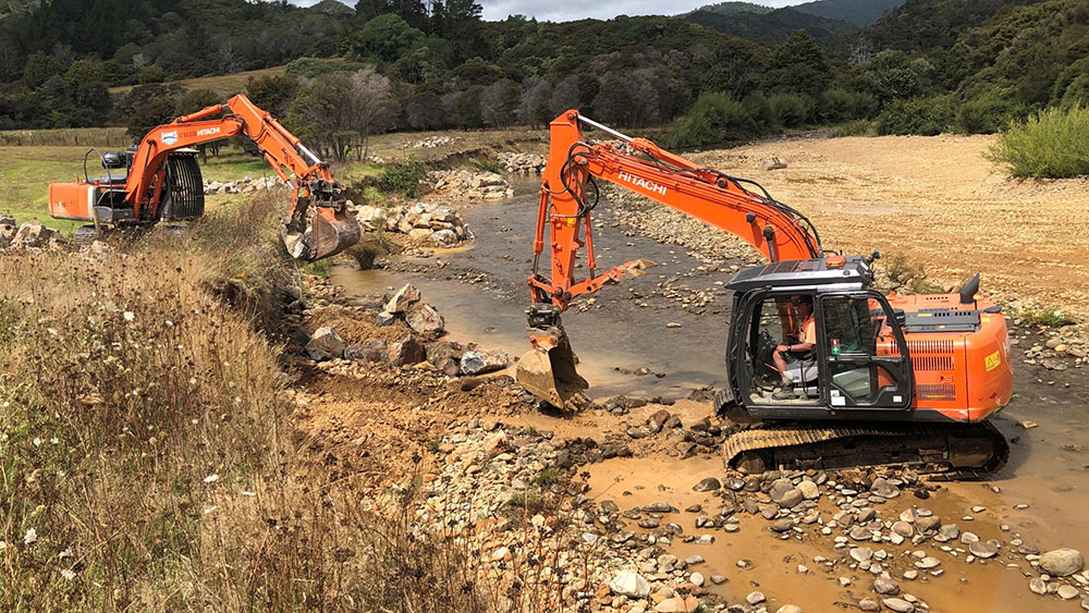 Installing the rock groynes.