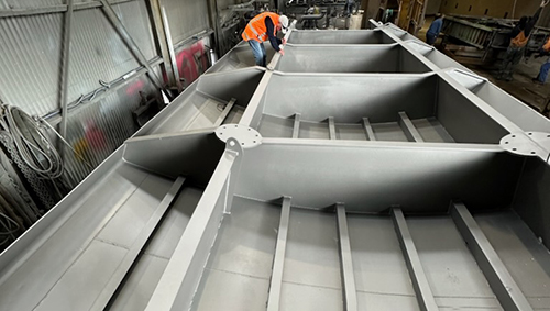 Working on the painting and welding of the Lake Waikare control gate