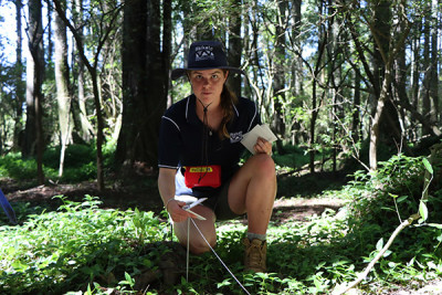 Image - Ayla Vette sets up a chew card along the 200 metre long transect out to an acoustic bird recorder.