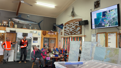 Response team briefing in a meeting room during Exercise Kārewa