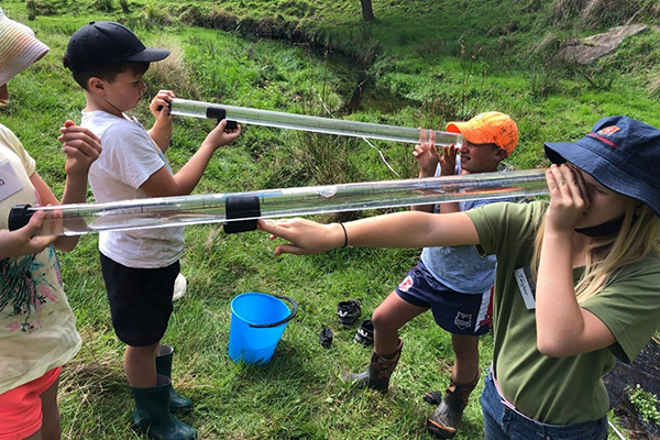 Students partaking in a water stream test