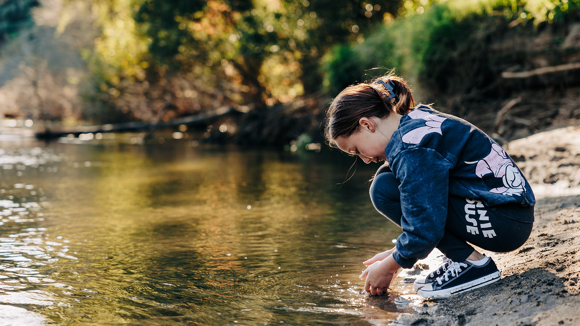 Image of young child by Waikato River at Hammond Park 