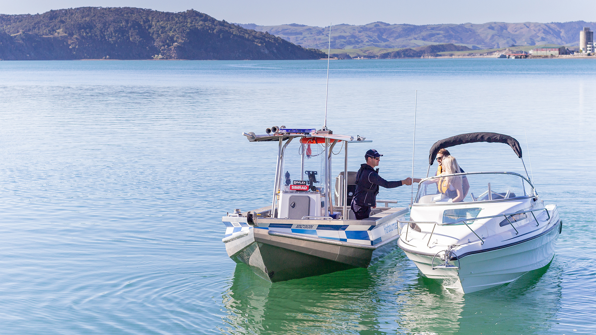 Photo of harbourmaster and people in boat