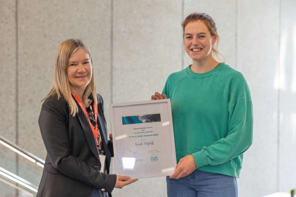 Joanne Ellis (left) presents award to Sarah Tetzlaff